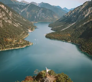 Woman walking at Plansee in Austria